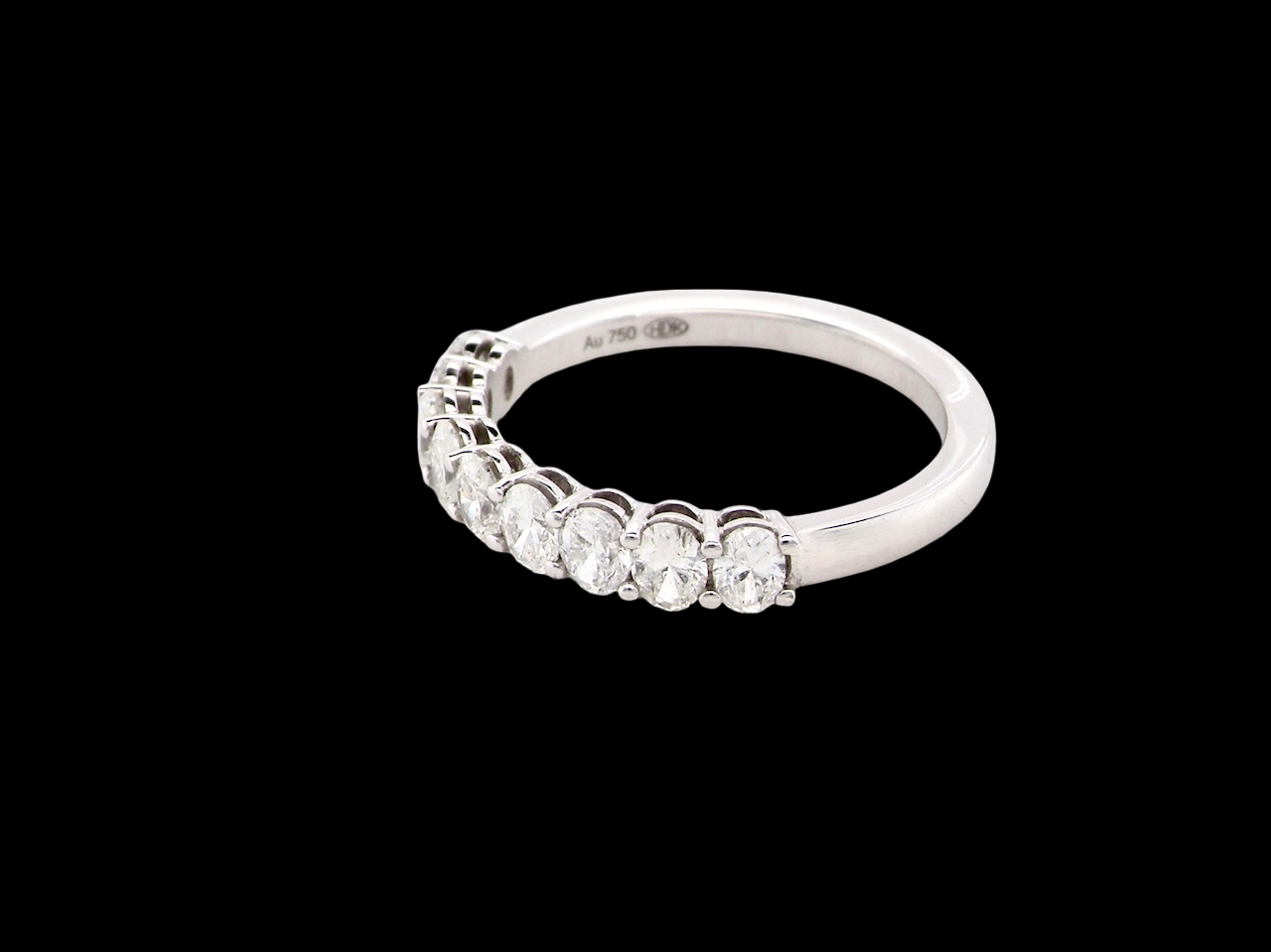 side gorgeous half-hoop eternity ring set with nine oval brilliant-cut white diamonds.