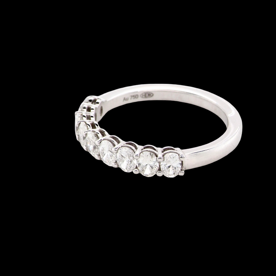 side gorgeous half-hoop eternity ring set with nine oval brilliant-cut white diamonds.
