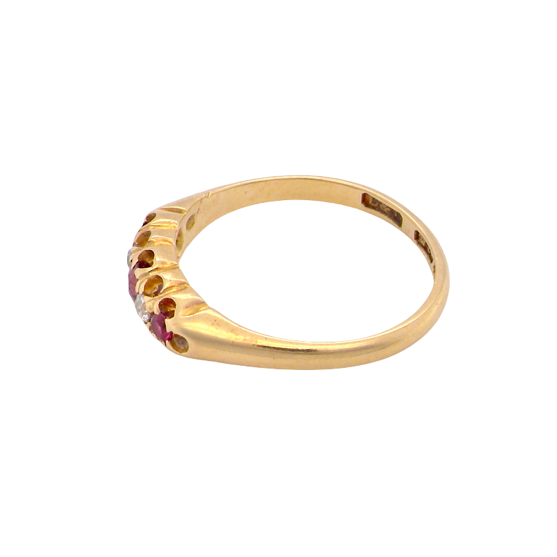 side A vintage 18 carat gold three stone ring. Set with brilliant cut white diamonds, cente 3mm, each side a 2.4mm diamond (total est 0.20 carats) Colour I-j, clarity Si. 