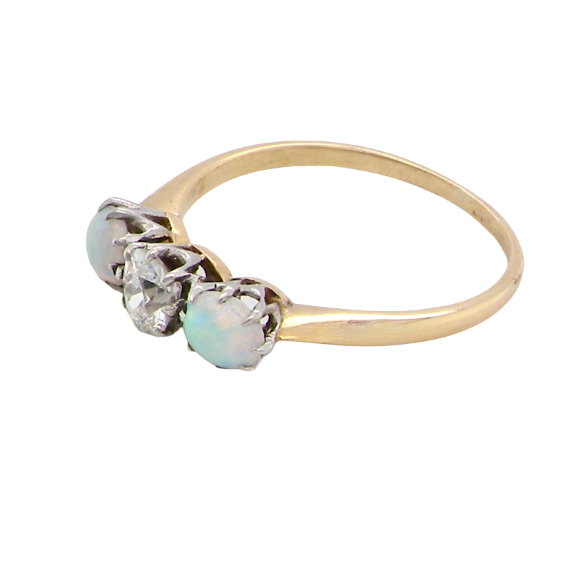 side opal A three stone ring, the centre stone an old brilliant cut white diamond 4.6mm (est 0.38 carats) colour i-j, clarity Si, claw set in platinum.