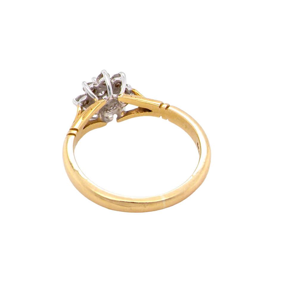 rear pretty cluster ring set with nine brilliant-cut white diamonds.