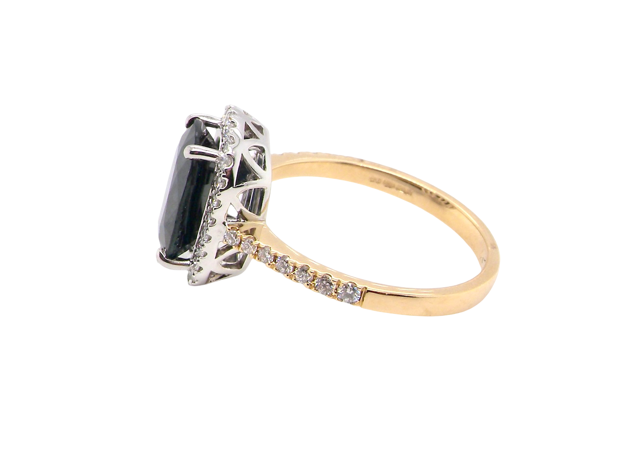 side striking cluster ring featuring a captivating ink-black blue sapphire,