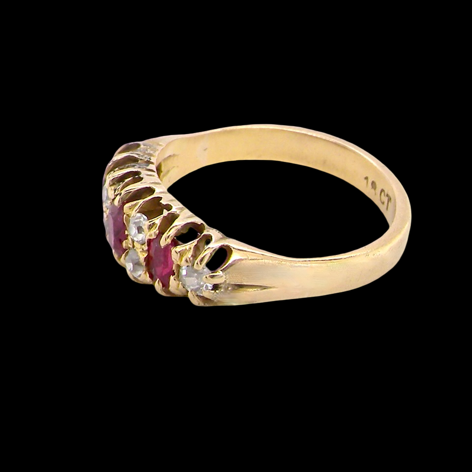 side typical boat shaped ring from the late Victorian era, probably 1890-1900. This ring is set with three oval cut rubies,
