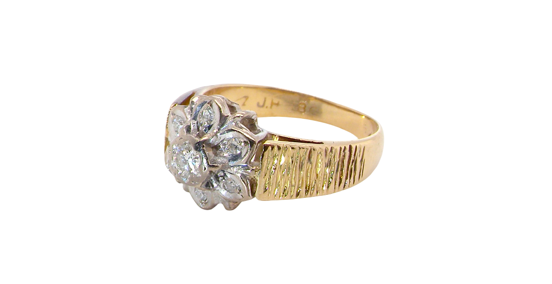 typical design from the 1960s/1970s era, a daisy cluster set with brilliant cut white diamonds