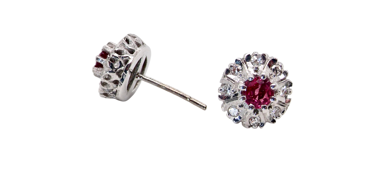 side view A fine pair of cluster earrings. Features to the centre a round 4.6mm pink sapphire (est 0.38 carats) with a good deep colour hue.