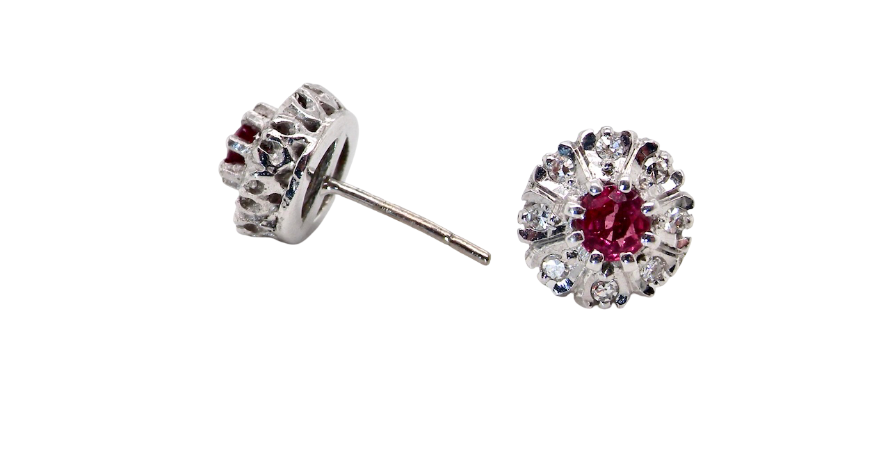 side view A fine pair of cluster earrings. Features to the centre a round 4.6mm pink sapphire (est 0.38 carats) with a good deep colour hue.