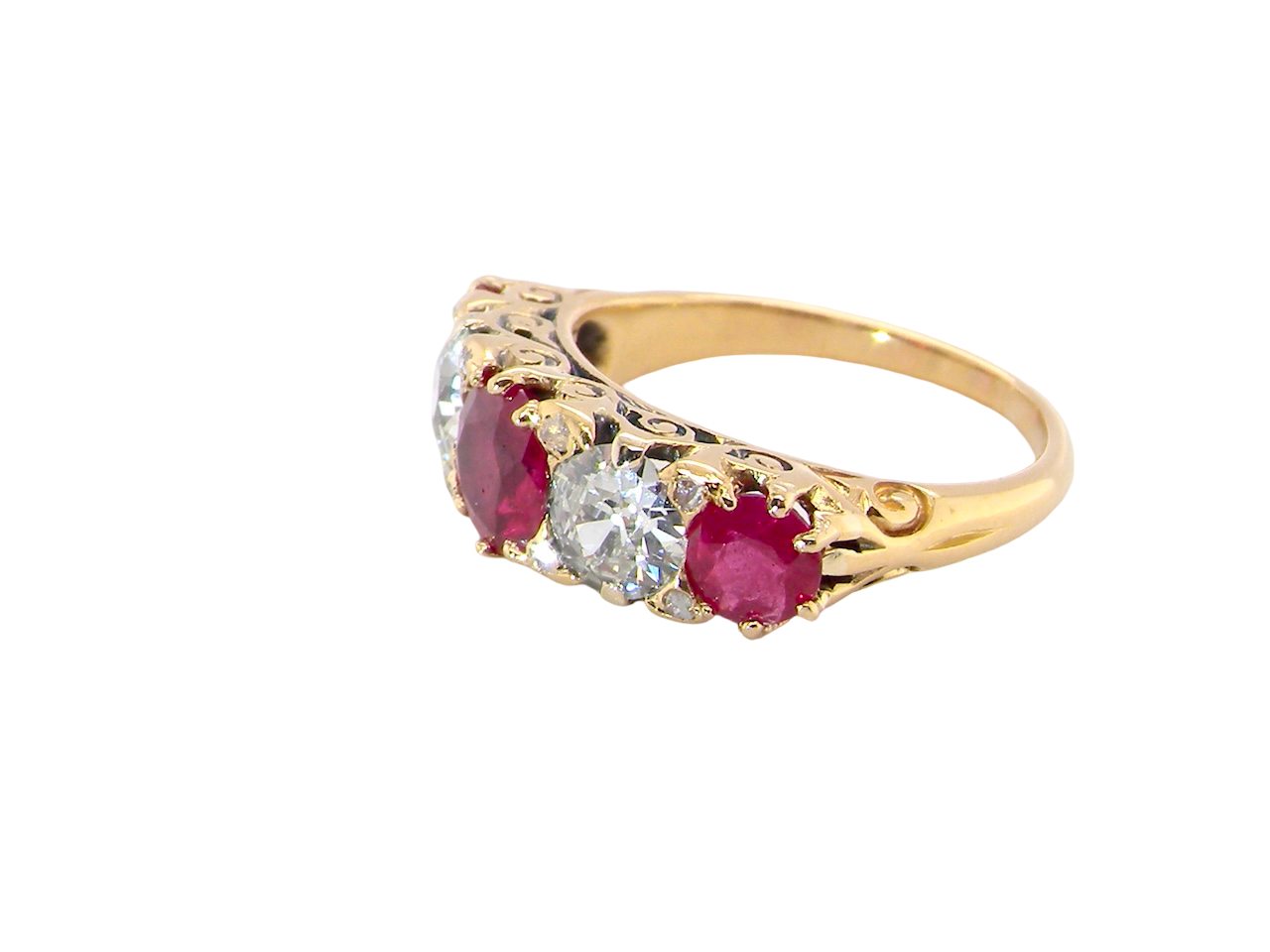 side view A superb Victorian ring, carved boat shaped head. Set with three fine rubies ,