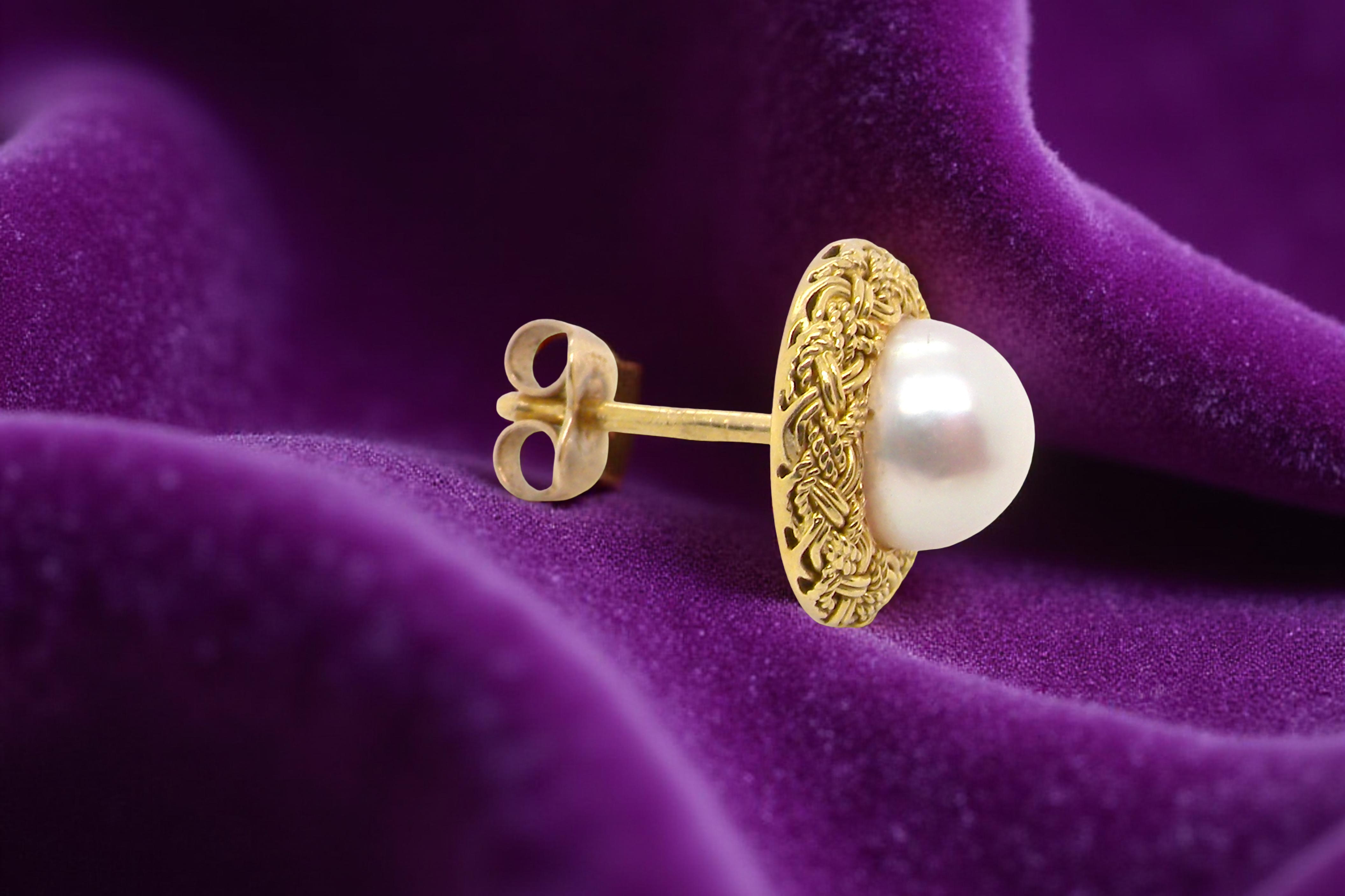 single A lovely pair of elegant earrings, each set with a 7.7 mm cultured pearl.