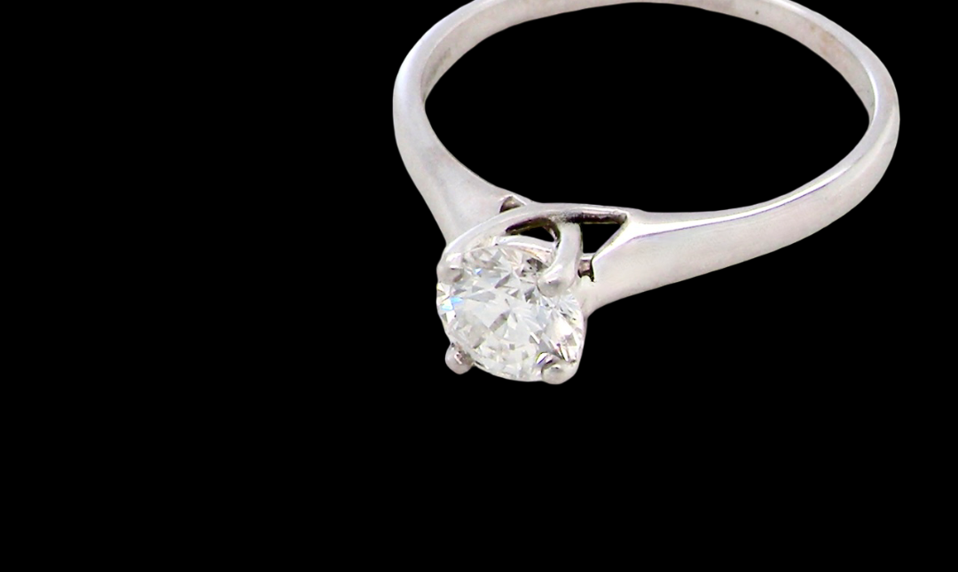 solitaire ring containing a fine modern brilliant cut white diamond. Measures 5.4mm (.53 carats)
Colour G-h, clarity Si. Modern feature under setting,