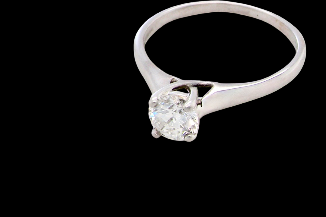 solitaire ring containing a fine modern brilliant cut white diamond. Measures 5.4mm (.53 carats)
Colour G-h, clarity Si. Modern feature under setting,
