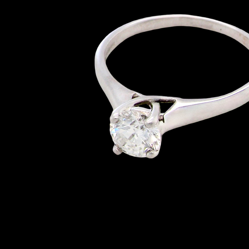 solitaire ring containing a fine modern brilliant cut white diamond. Measures 5.4mm (.53 carats)
Colour G-h, clarity Si. Modern feature under setting,