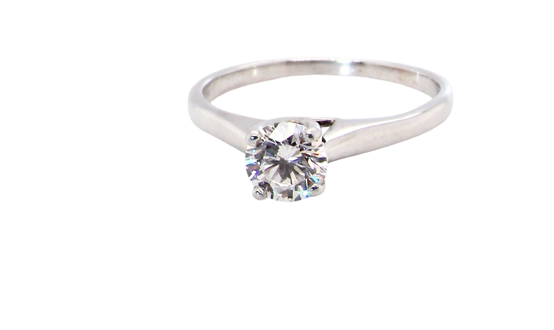 solitaire ring containing a fine modern brilliant cut white diamond. Measures 5.4mm (.53 carats)
Colour G-h, clarity Si. Modern feature under setting, depth 6.8mm,