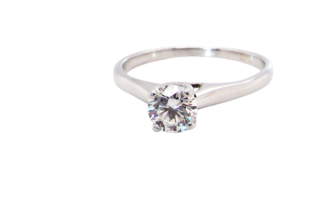 solitaire ring containing a fine modern brilliant cut white diamond. Measures 5.4mm (.53 carats)
Colour G-h, clarity Si. Modern feature under setting, depth 6.8mm,