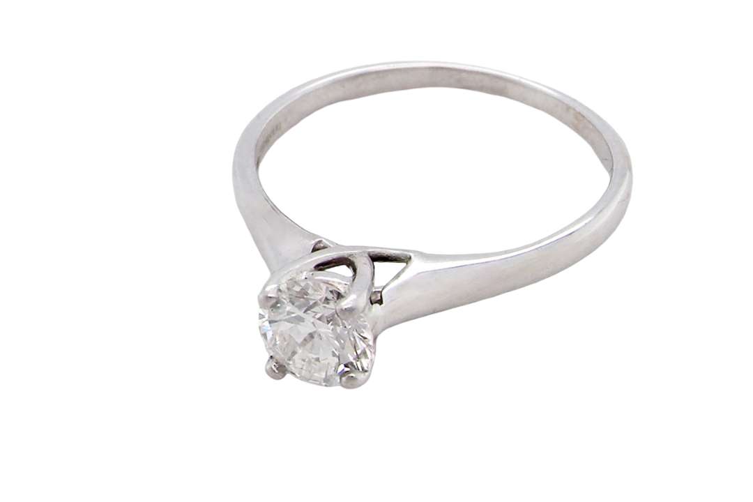 solitaire ring containing a fine modern brilliant cut white diamond. Measures 5.4mm (.53 carats)
Colour G-h, clarity Si. Modern feature under setting, depth 6.8mm, weight 2.6grams.
above