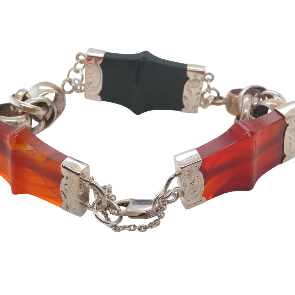 sterling silver bracelet of Scottish origin, featuring a panel of bold, shaped links. Each panel link measures 35 × 20 mm.