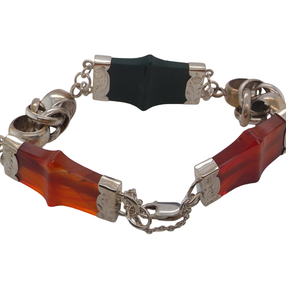 sterling silver bracelet of Scottish origin, featuring a panel of bold, shaped links. Each panel link measures approximately 35 × 20 mm.