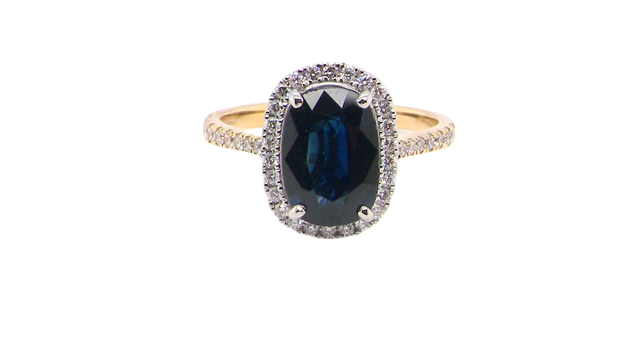 striking cluster ring featuring a captivating ink-black blue sapphire,