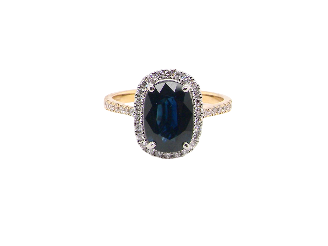 striking cluster ring featuring a captivating ink-black blue sapphire,