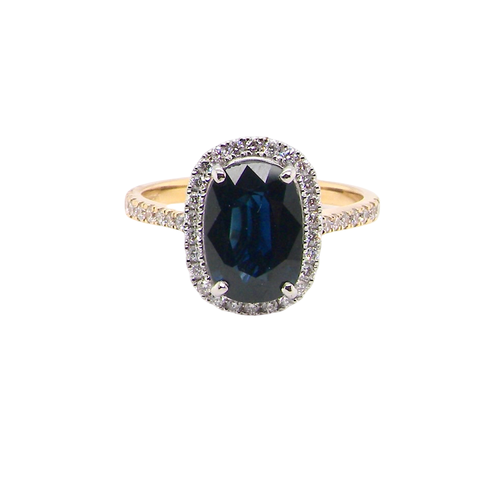 striking cluster ring featuring a captivating ink-black blue sapphire,