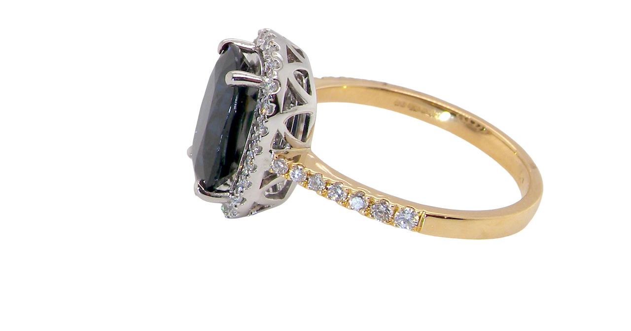 striking cluster ring featuring a captivating ink-black blue sapphire,A