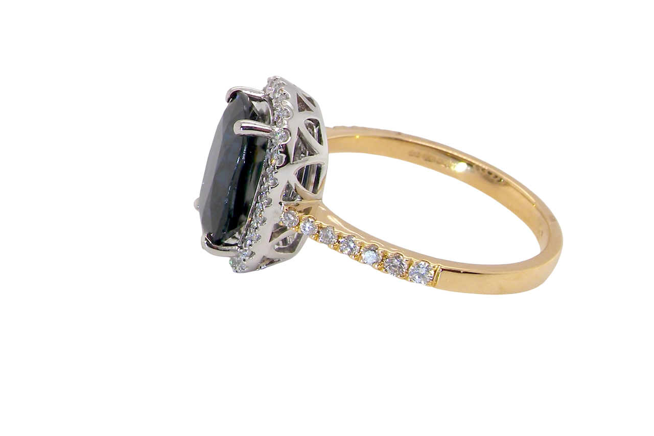 striking cluster ring featuring a captivating ink-black blue sapphire,A