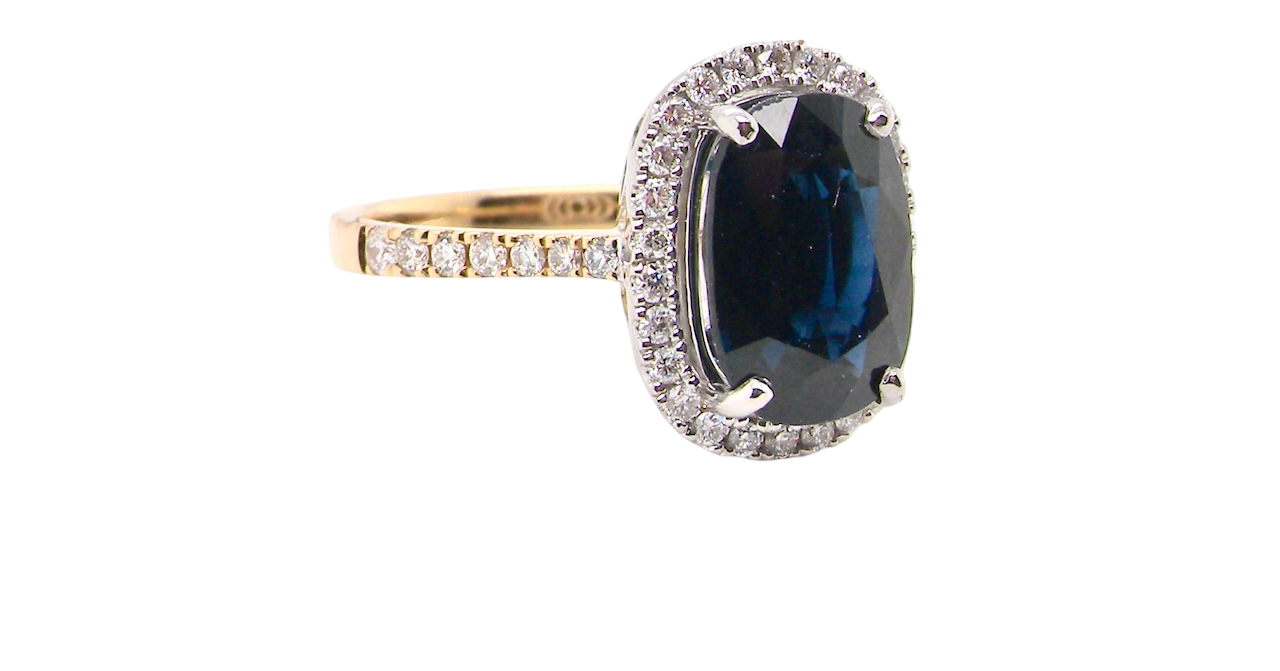 striking cluster ring featuring a ink-black blue sapphire,