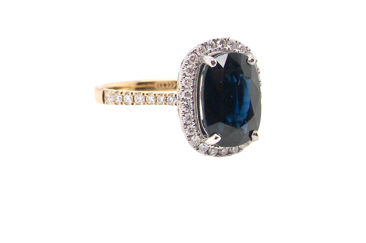 striking cluster ring featuring a ink-black blue sapphire,