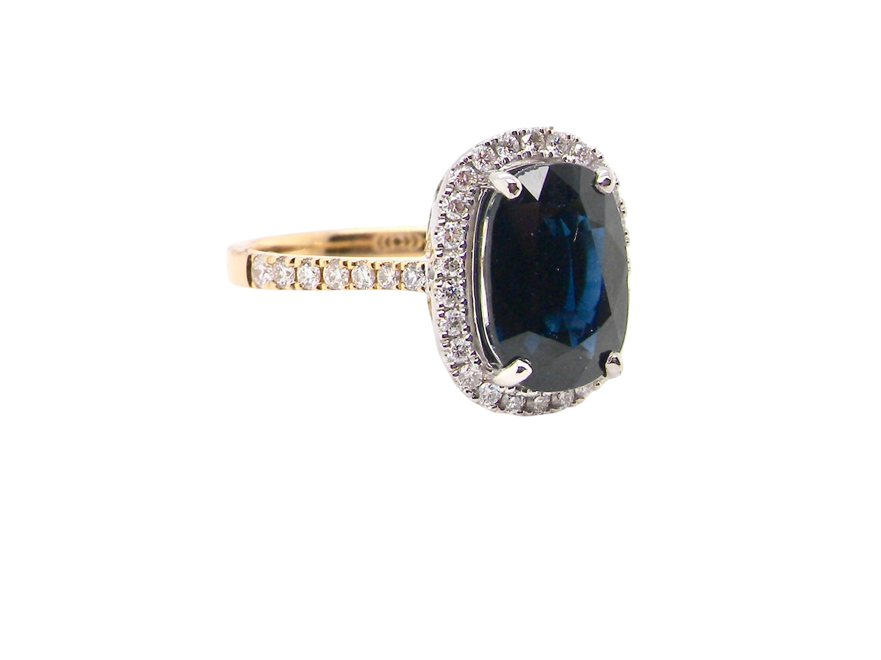 striking cluster ring featuring a ink-black blue sapphire,