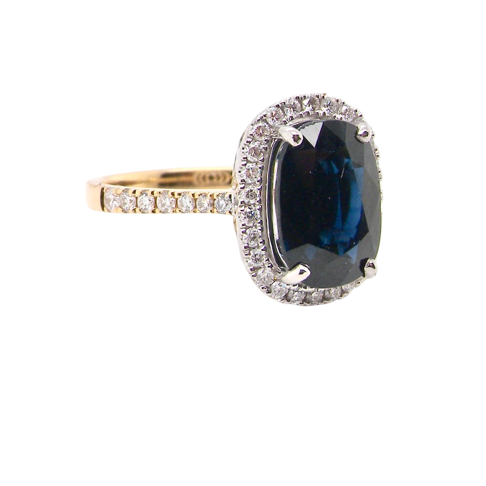 striking cluster ring featuring a ink-black blue sapphire,