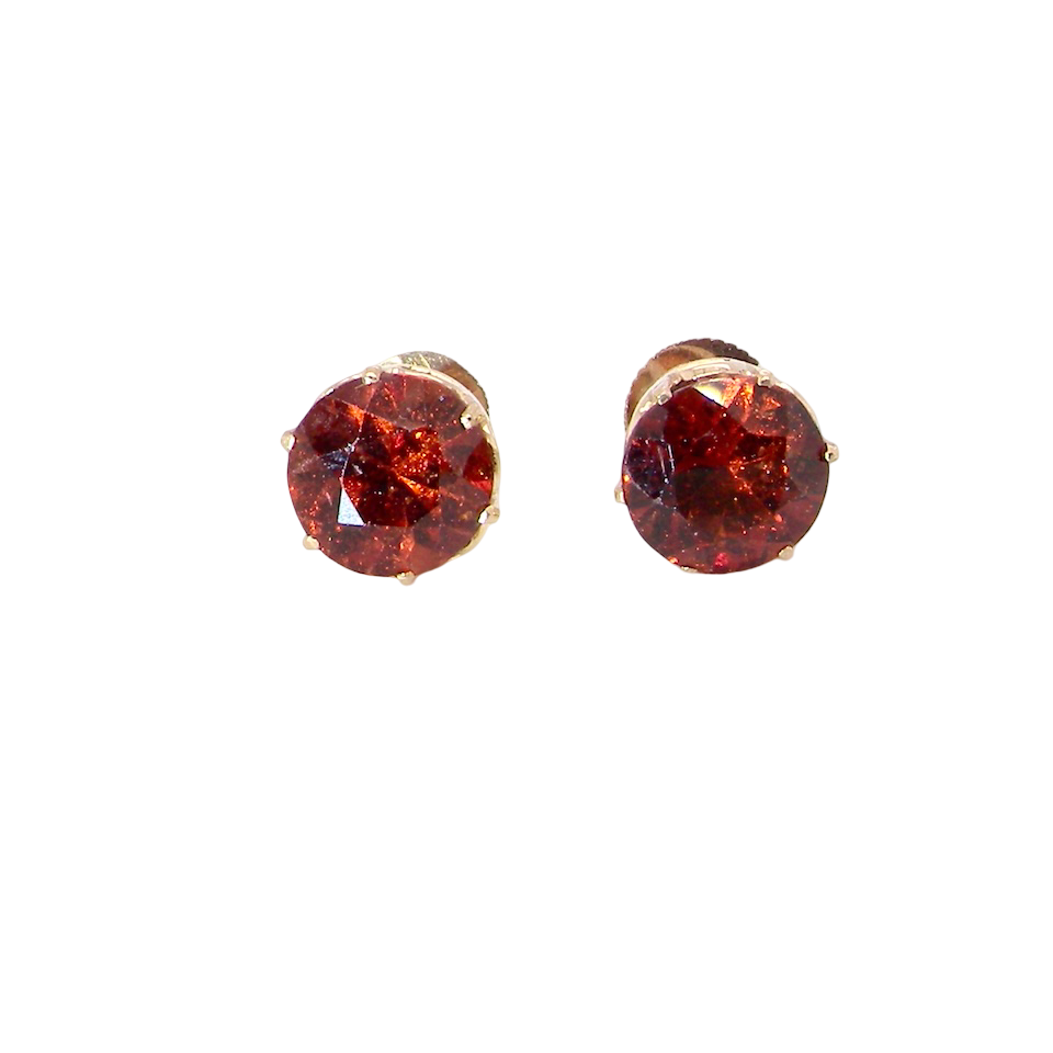 stud earrings. Each one is set with a round garnet, 8mm diameter