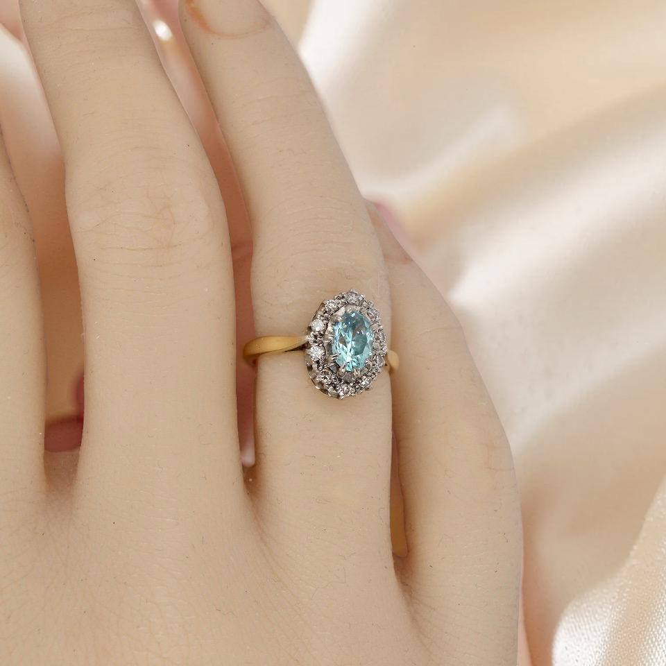 tape A cluster ring set with a natural blue zircon centre stone, 7.5x5mm, vibrant aquamarine colour. 