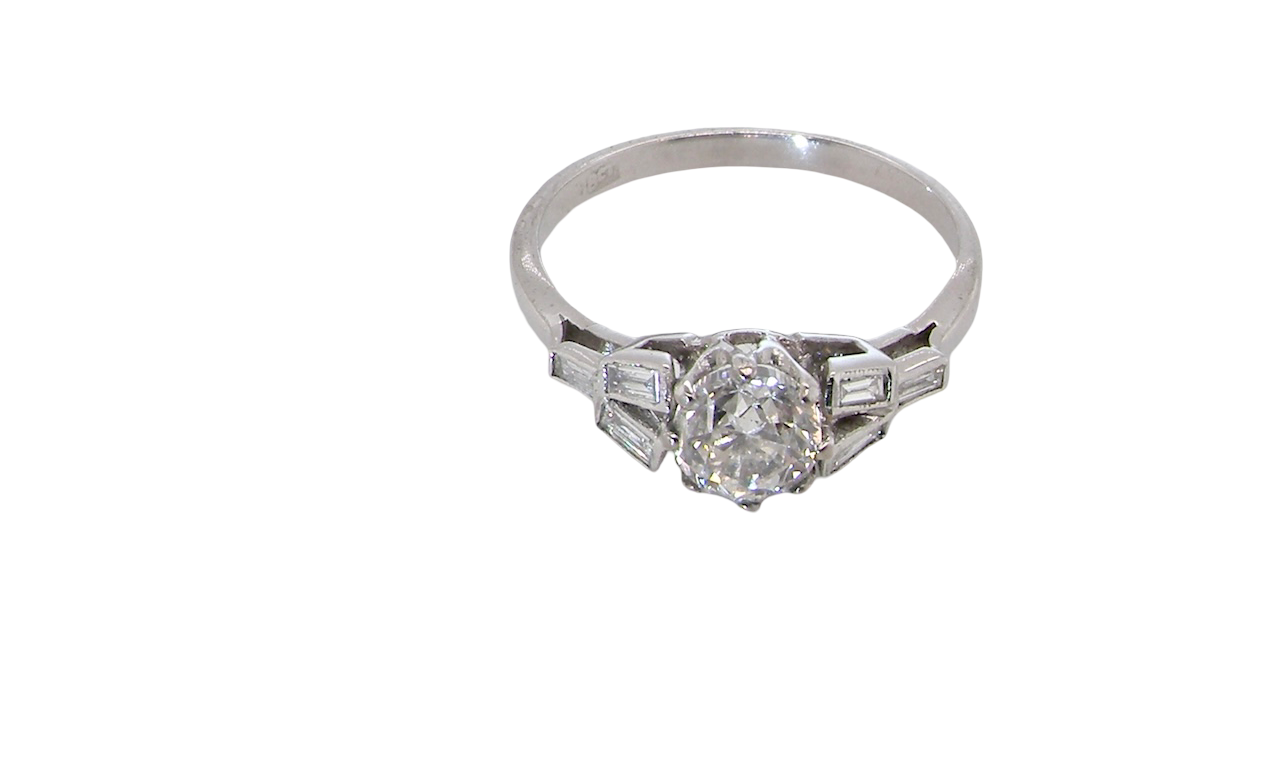 A beautifully proportioned Art Deco solitaire ring showcasing a sparkling old brilliant cut white diamond