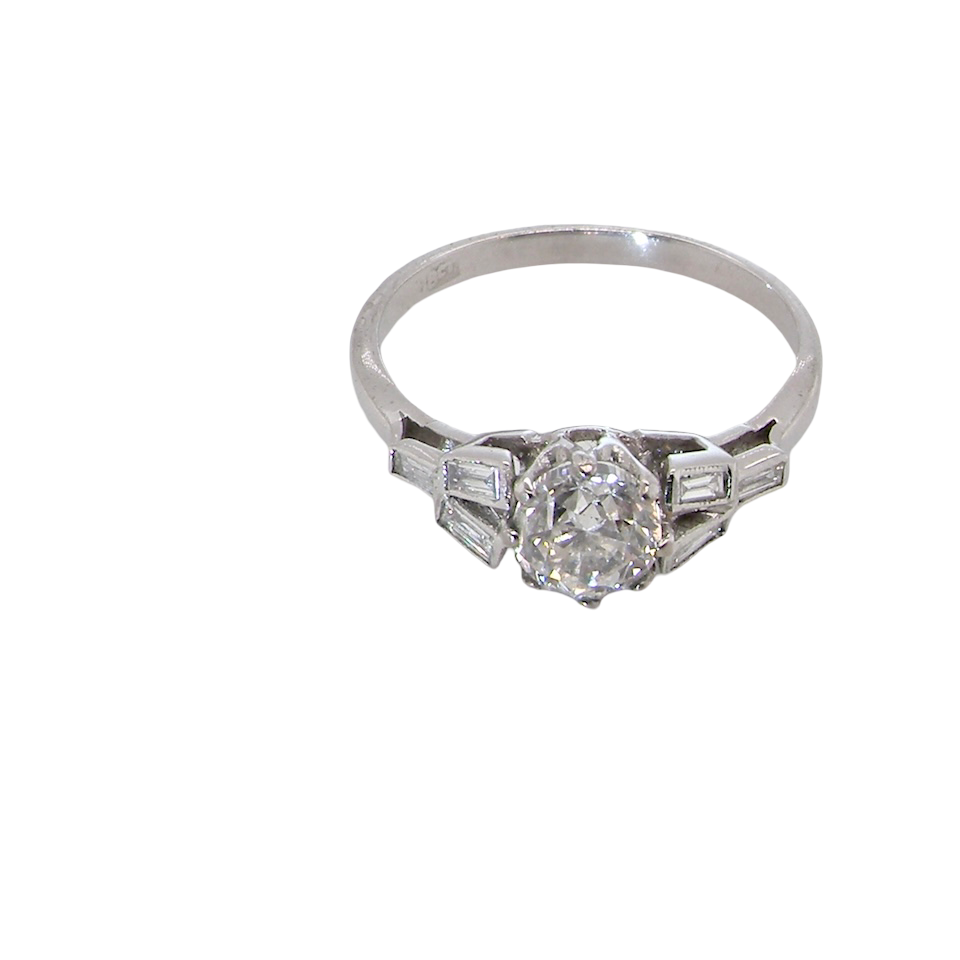 A beautifully proportioned Art Deco solitaire ring showcasing a sparkling old brilliant cut white diamond