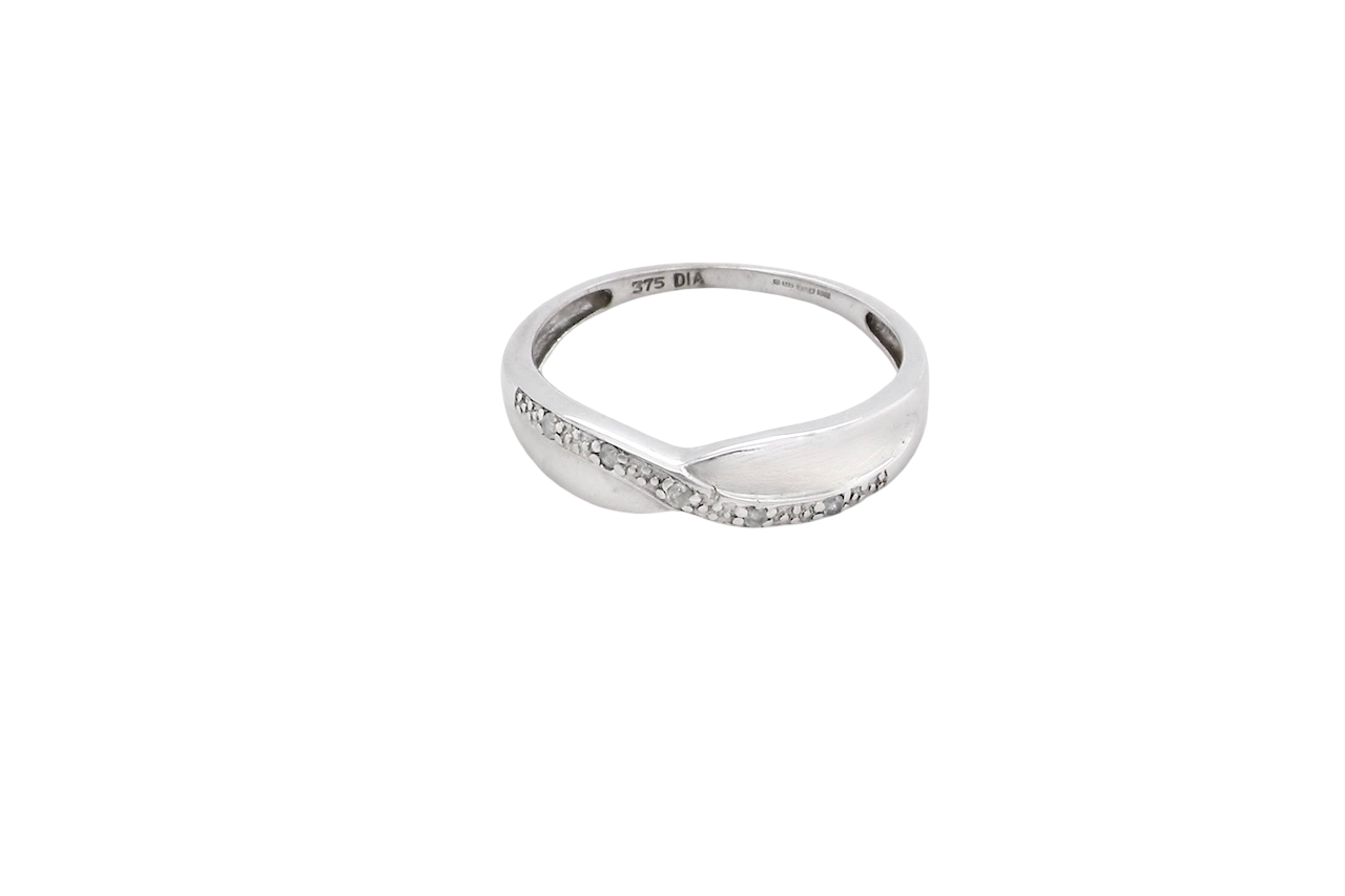 top A half hoop 9 carat white gold eternity ring. Set with five small white diamonds, each 1.3mm (total 0.05 carats)