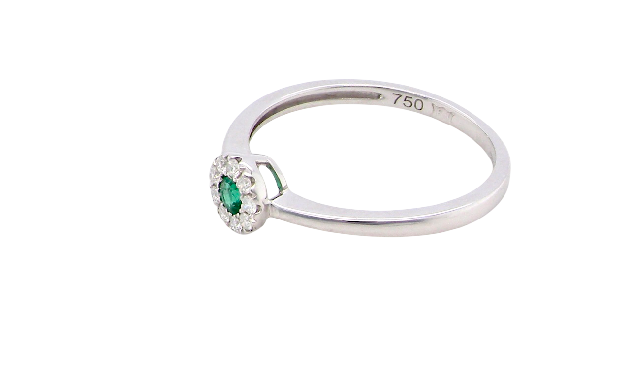 top A mini cluster fashioned in 18 carat white gold. The round emerald measures 2.7mm (0.05 carats) 