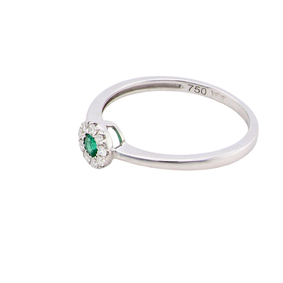 top A mini cluster fashioned in 18 carat white gold. The round emerald measures 2.7mm (0.05 carats) 
