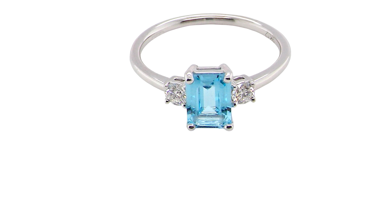 top A 9 carat white gold three stone ring. This ring is from our Heirloom Collection. This is when we take a stone from a pre-owned ring that is worn out, and reset it into a brand new setting.