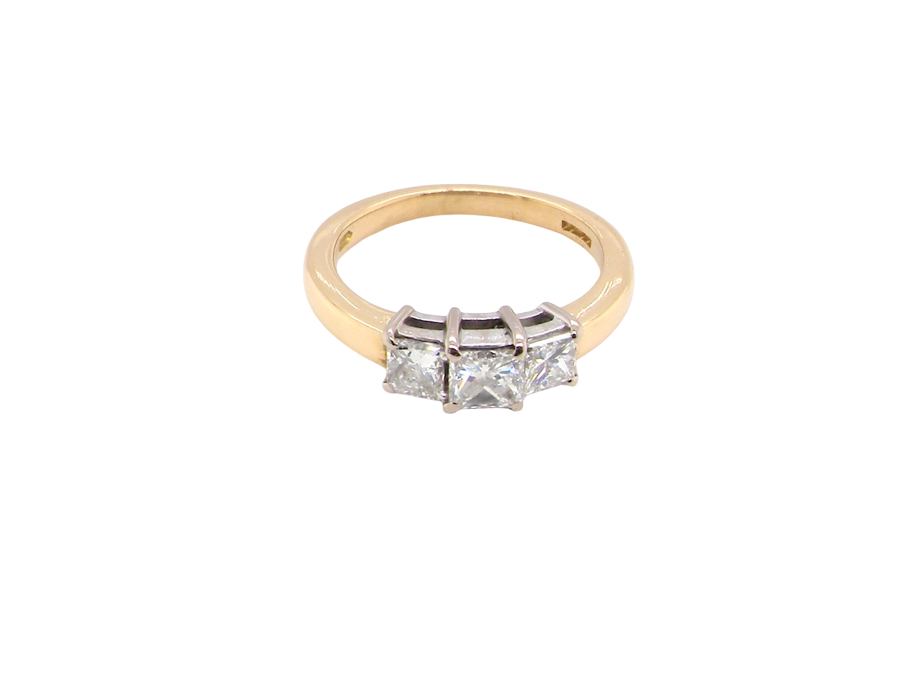 Gold ring with two diamonds on a white background