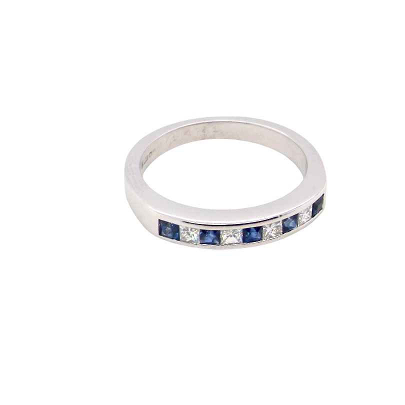 top An 18 carat white gold half hoop eternity ring. Set with princess cut white diamonds, total of four- estimated 0.40 carats (2.4mm each) colour H-j, clarity Si.