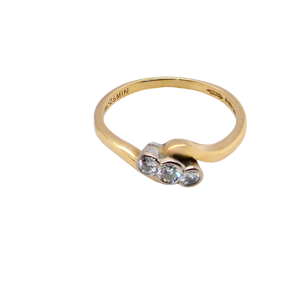 top An 18 carat yellow gold three stone ring, cross over style, and set with brilliant cut white diamonds.
Centre stone 3mm (0.10 carats)