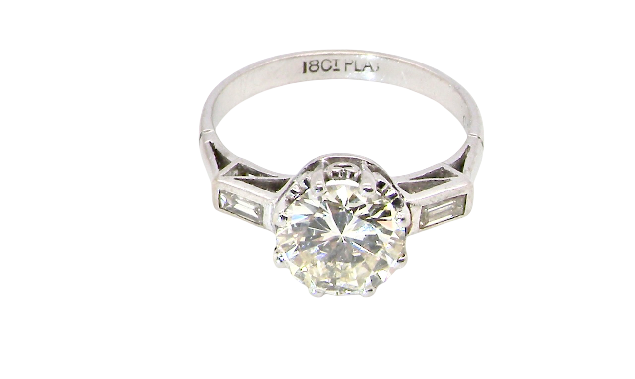 top An Art Deco solitaire ring showcasing a beautiful 1.75 carat diamond