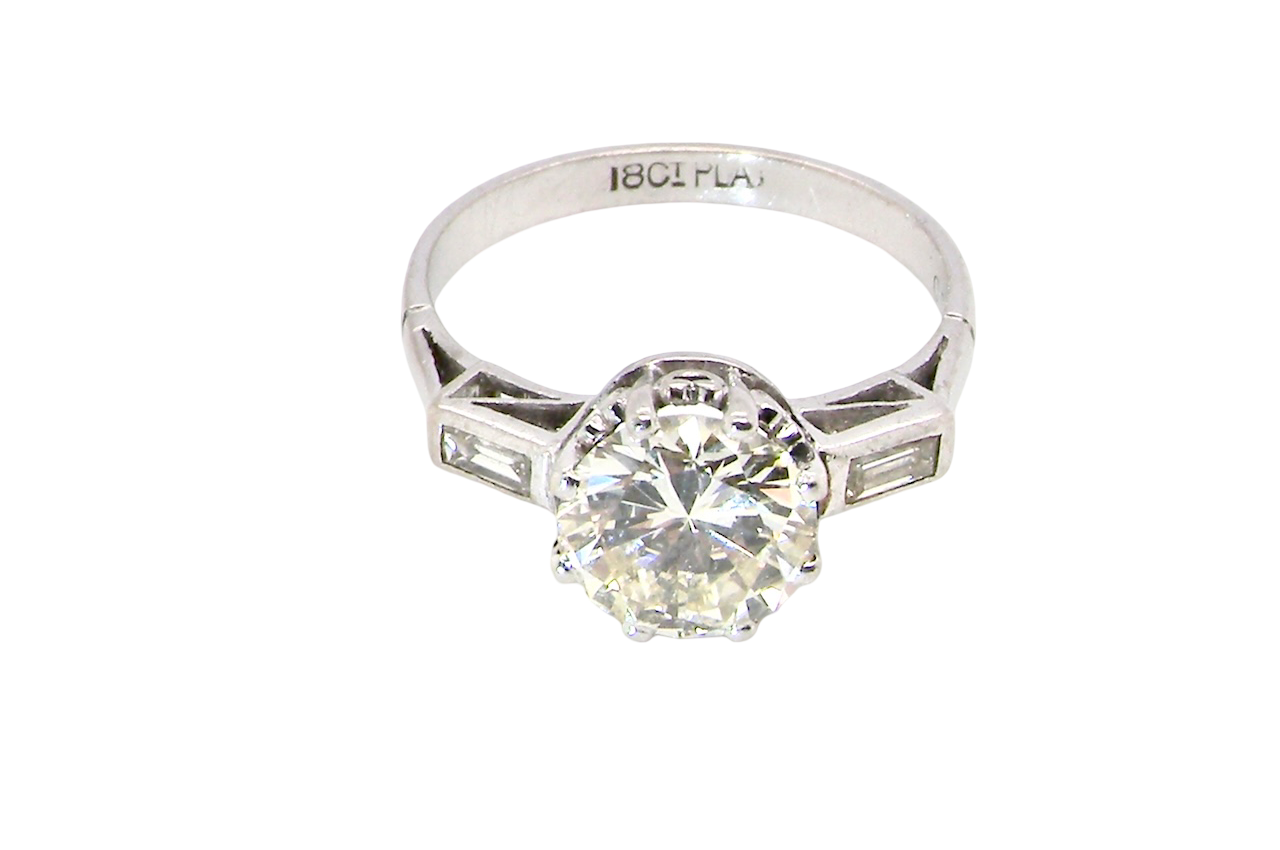 top An Art Deco solitaire ring showcasing a beautiful 1.75 carat diamond