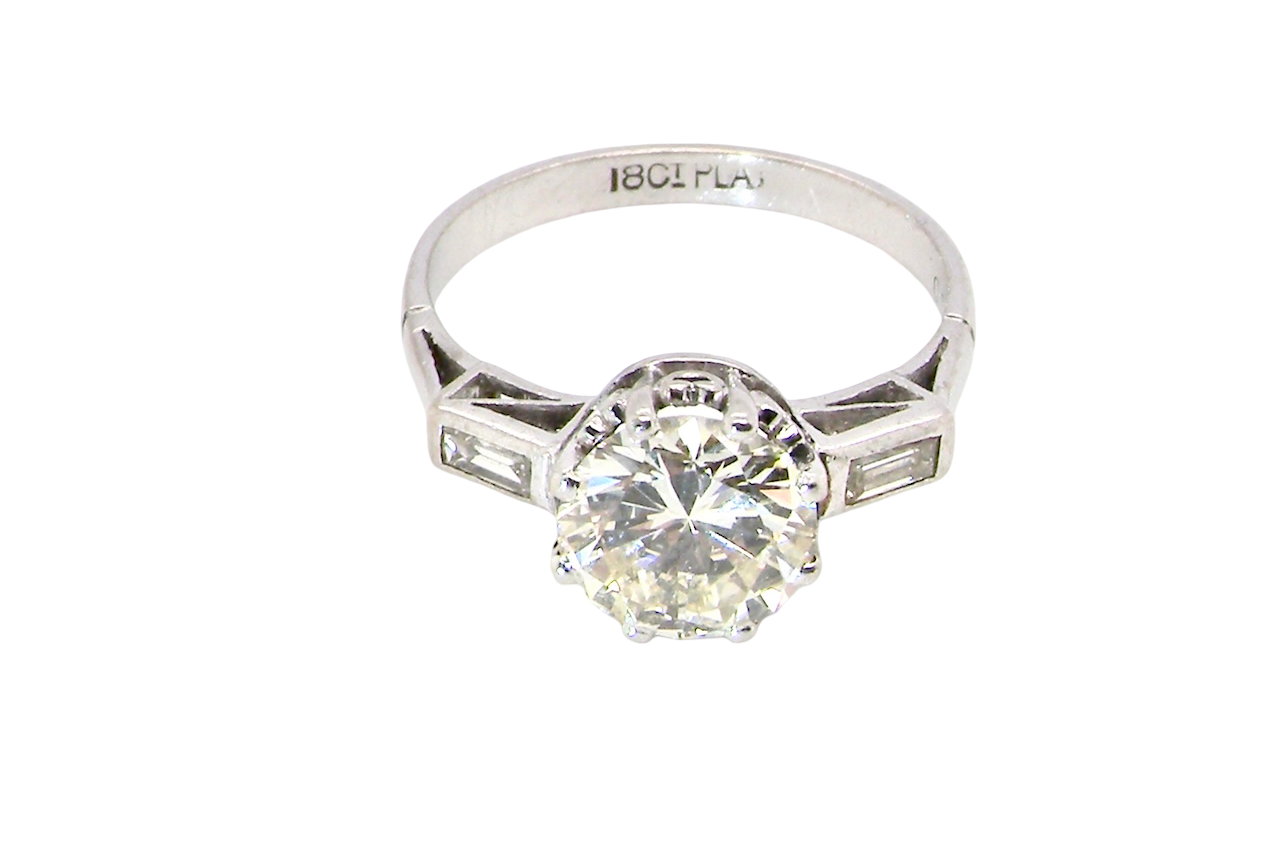 top An Art Deco solitaire ring showcasing a beautiful 1.75 carat diamond