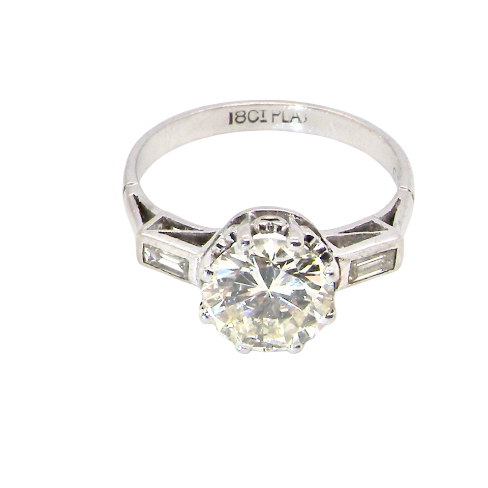 top An Art Deco solitaire ring showcasing a beautiful 1.75 carat diamond
