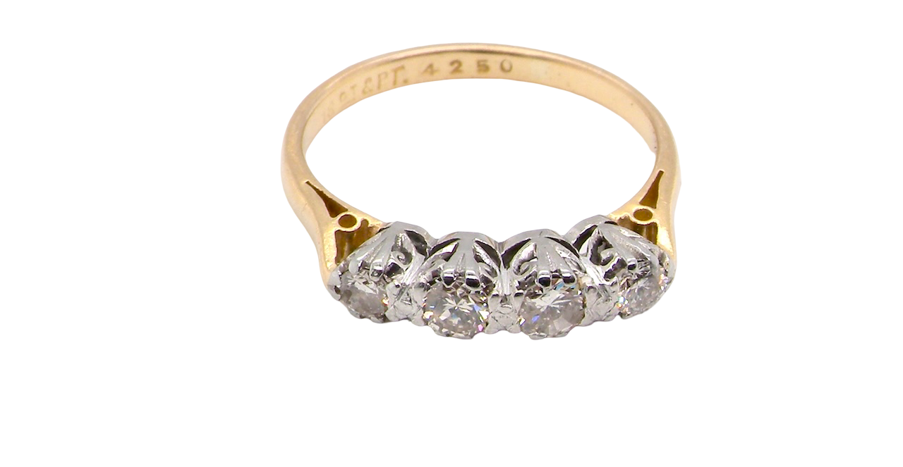 top An early 20th century ring set with diamonds.
