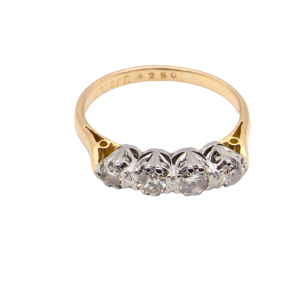 top An early 20th century ring set with diamonds.