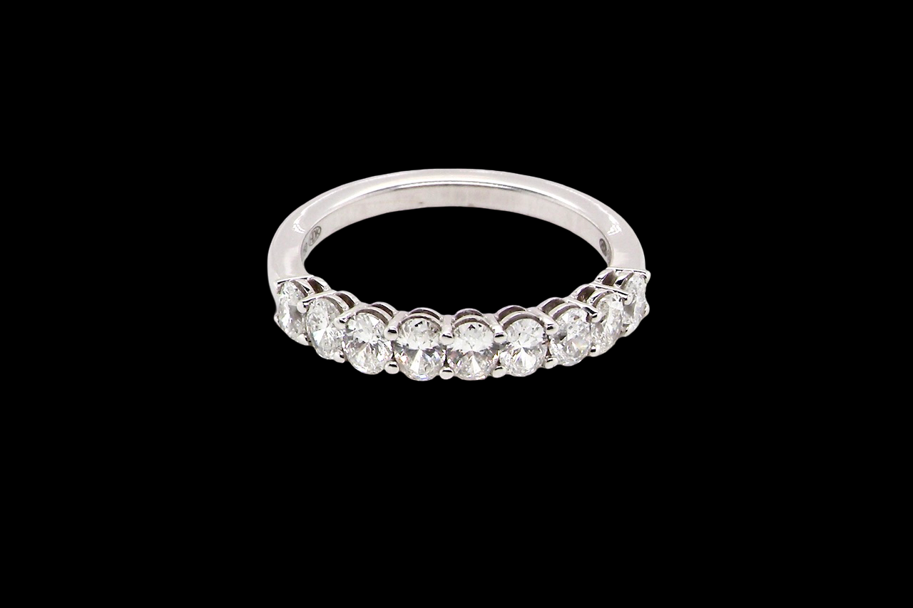top gorgeous half-hoop eternity ring set with nine oval brilliant-cut white diamonds.