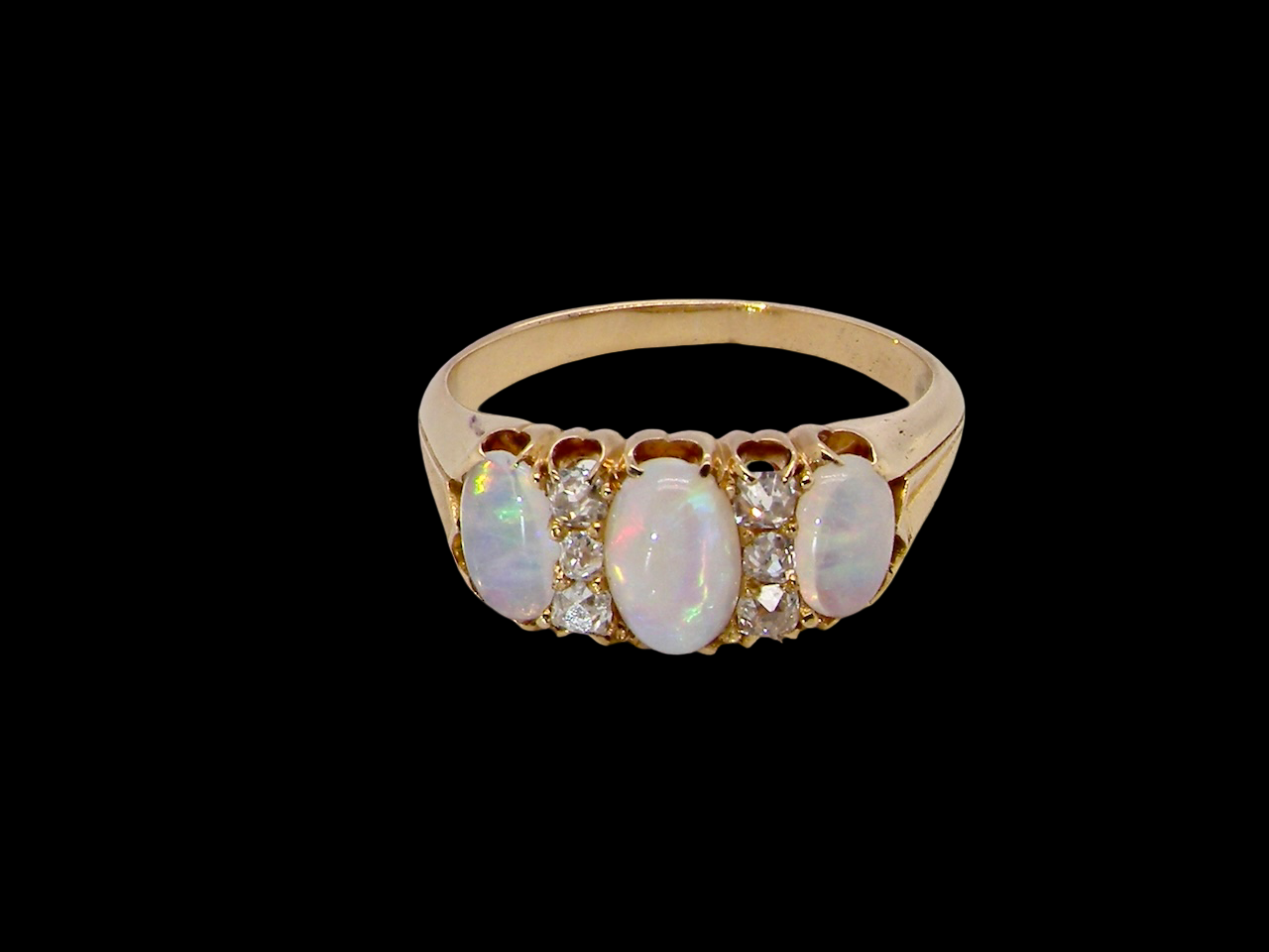 top view A beautiful Victorian dress ring, set with three finely matched oval opals,
