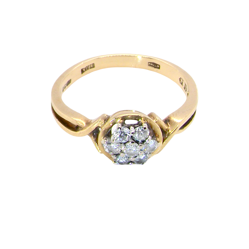 top view A classic 1980s cluster ring. Seven brilliant cut white diamonds , each 2.5mm (est 0.40 carats). Colour i-j, clarity Si. Claw set in white gold.