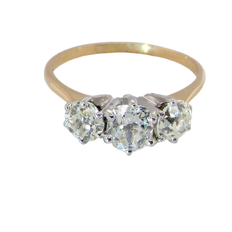 A three-stone diamond ring with a yellow gold band and silver-colored settings, featuring three round-cut diamonds on a plain white background.